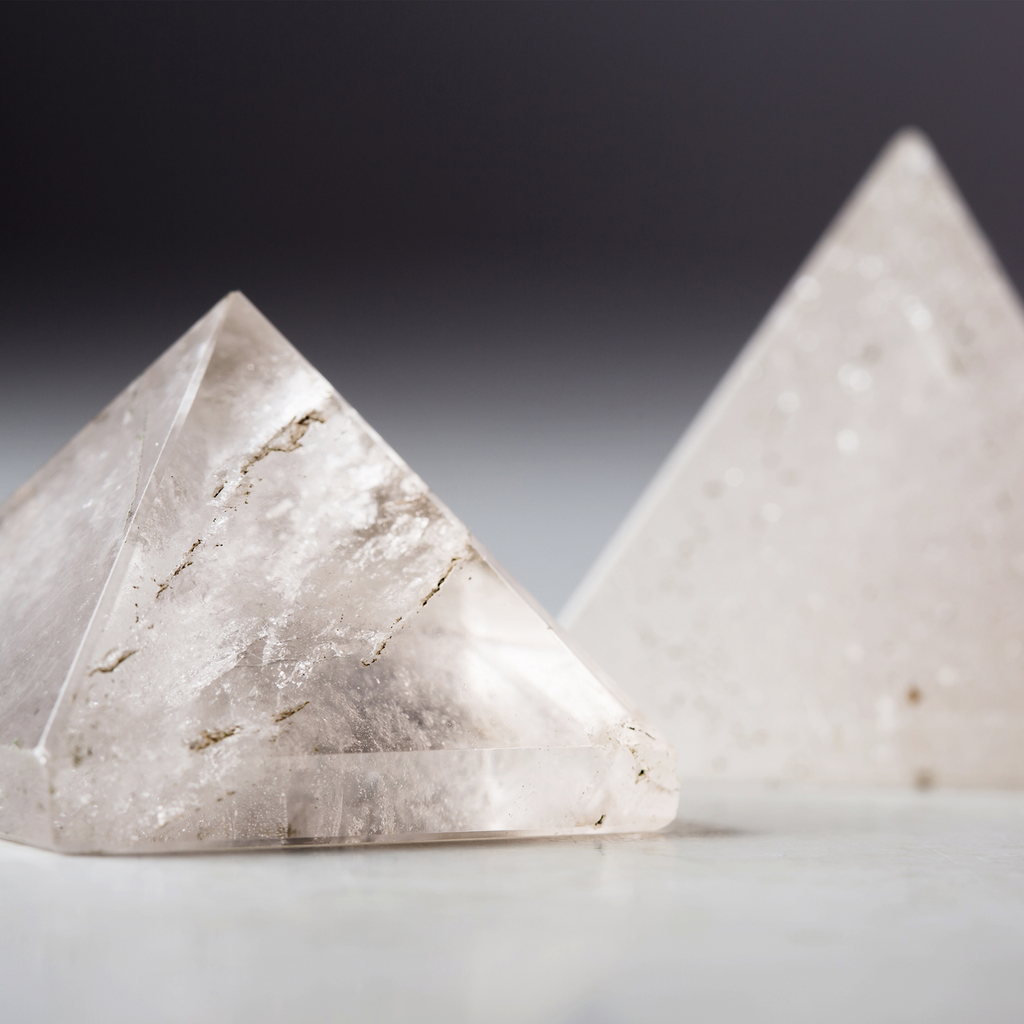 crystal clear quartz pyramids with two sizes, featuring pyramids crystal carvings. 