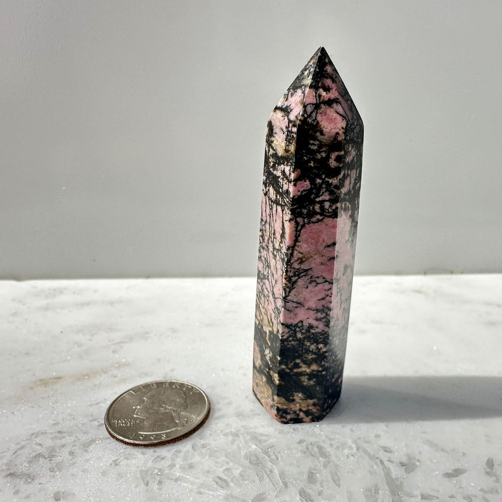 Rhodonite Crystal Tower to scale with a quarter