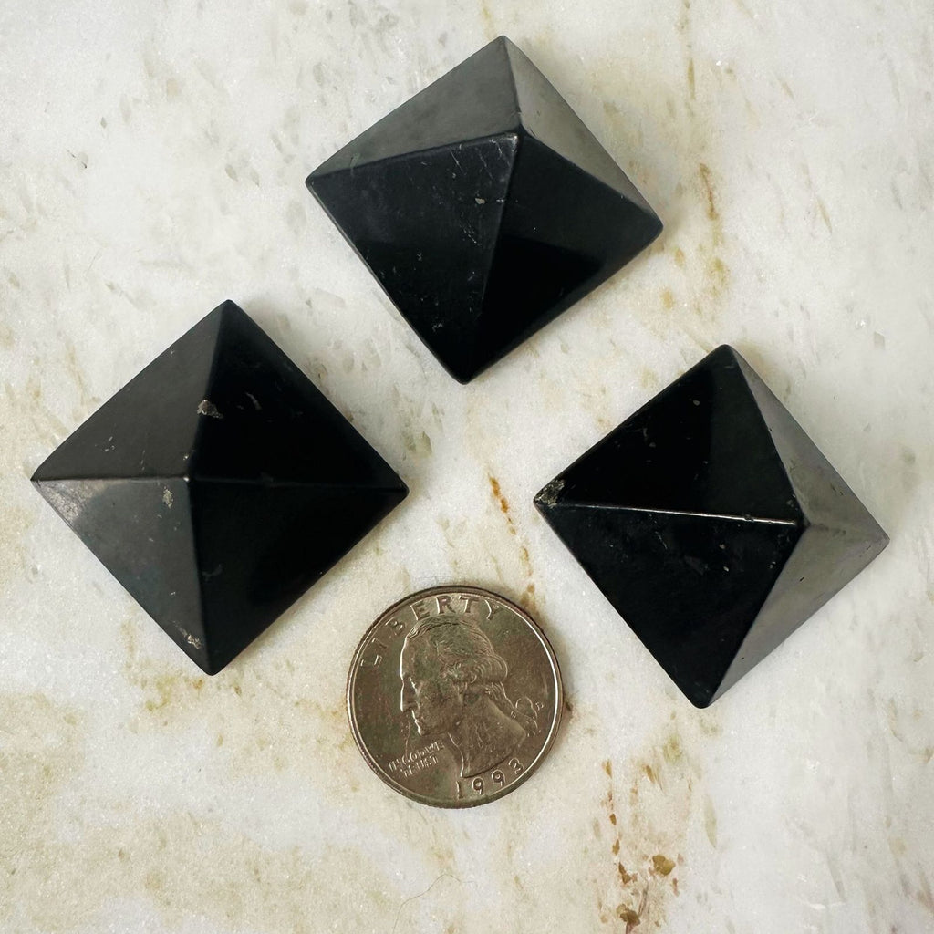 3 shungite pyramid with quarter for size