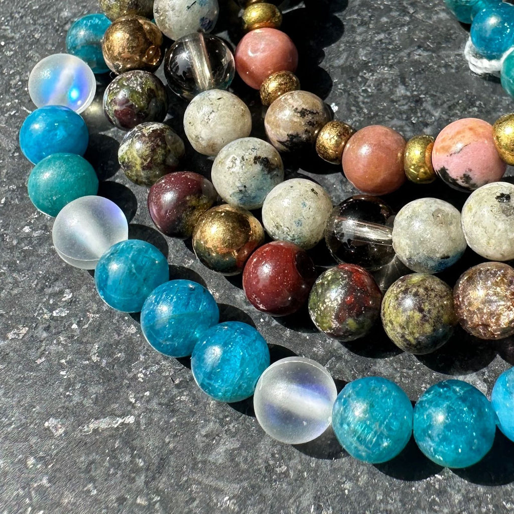 selection of intuitive and intentional handmade all natural crystal bracelets made for specific energetic vibrations