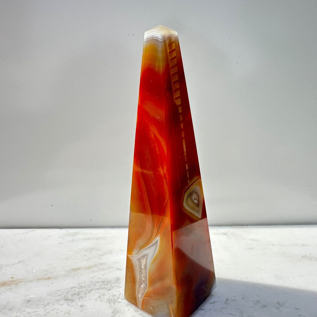 Orange Dyed Agate Obelisk in Natural Sunlight