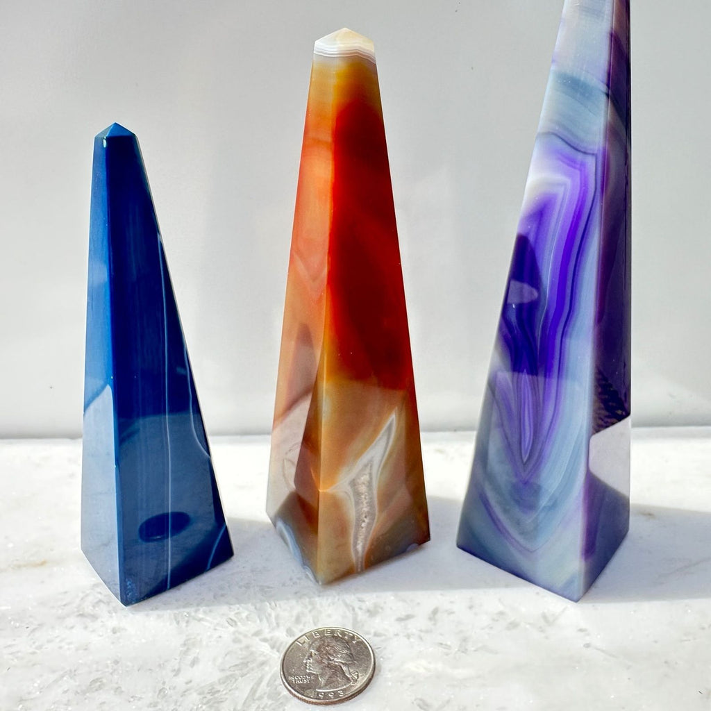 Dyed Brazilian Agate Obelisks with Quarter for size
