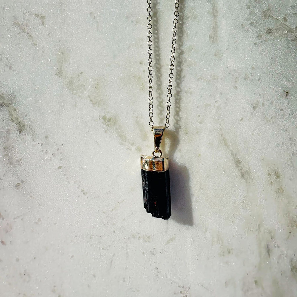 Raw Black Tourmaline Crystal pendant from Brazil, beautifully displayed with silver plating necklace