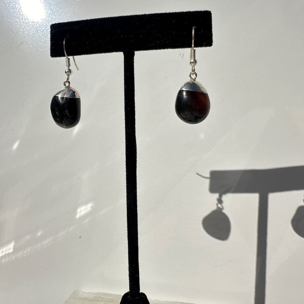 Black Obsidian Crystal Earrings on a stand