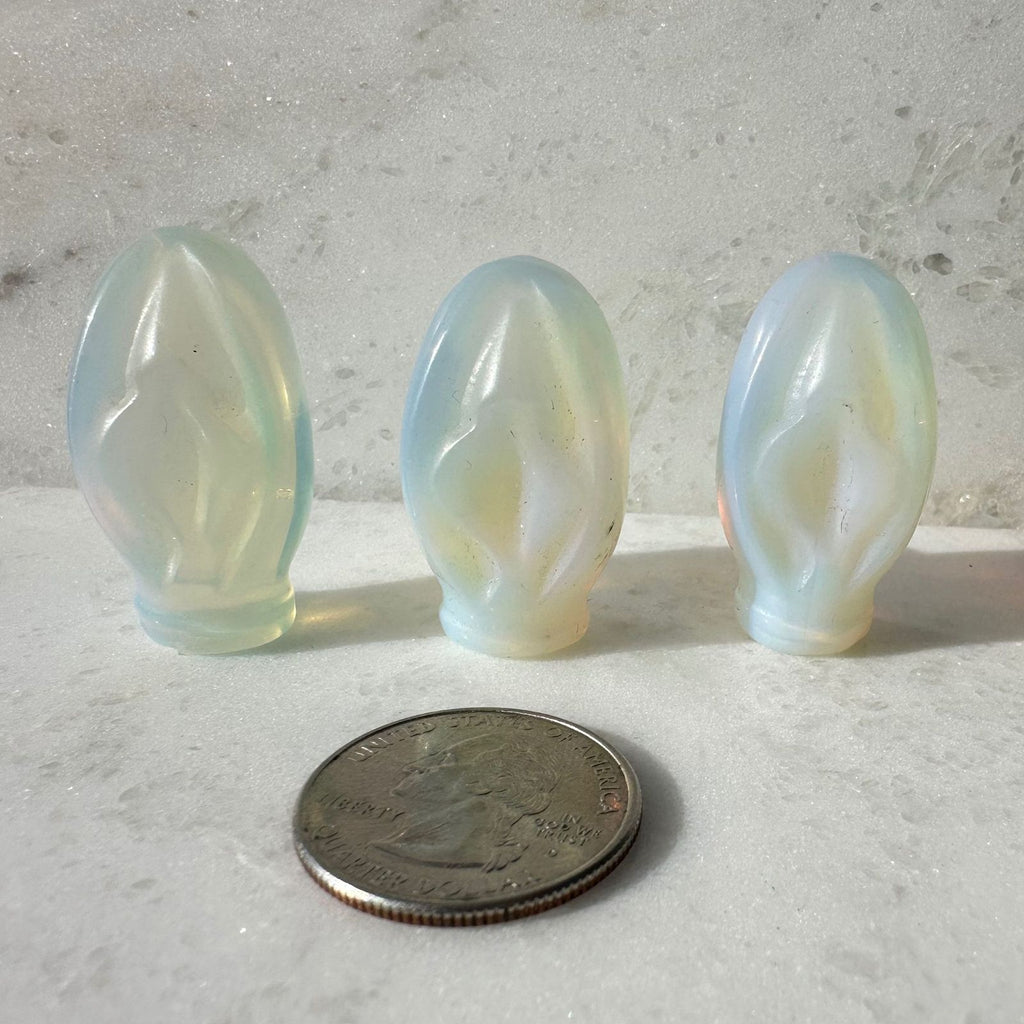 Opalite Portal to Paradise crystal vulva carving with quarter for size reference