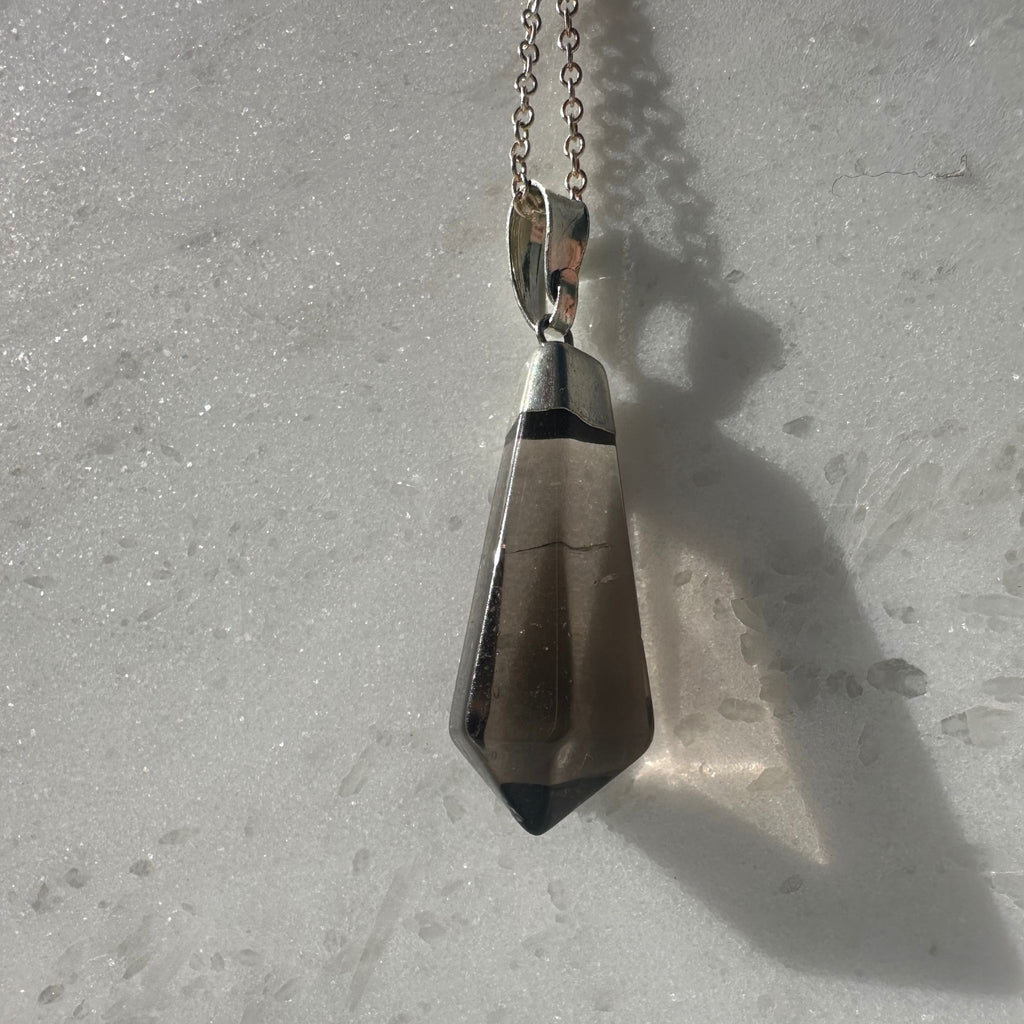 Smoky Quartz Point Pendant Necklace on a silver plated chain