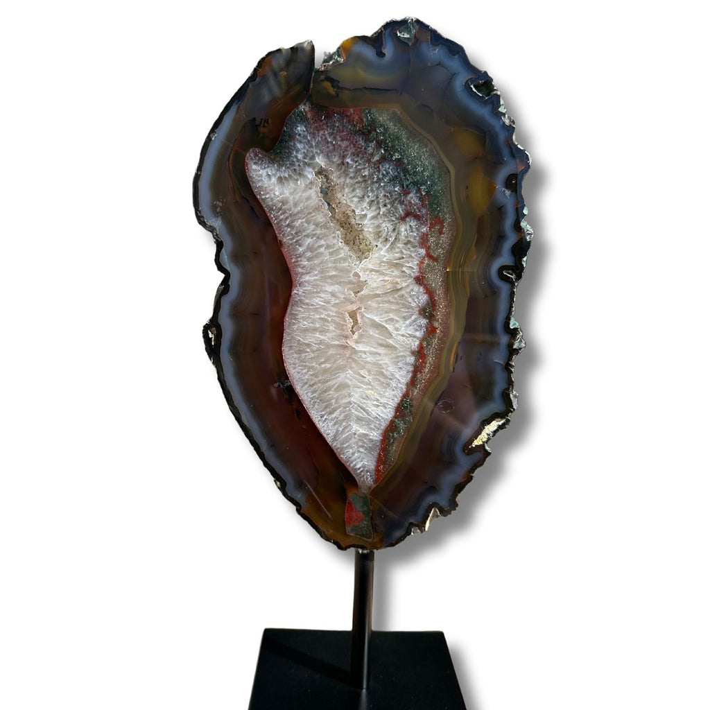 Brazilian agate slice on a stand, featuring banded agate and clear quartz inclusions