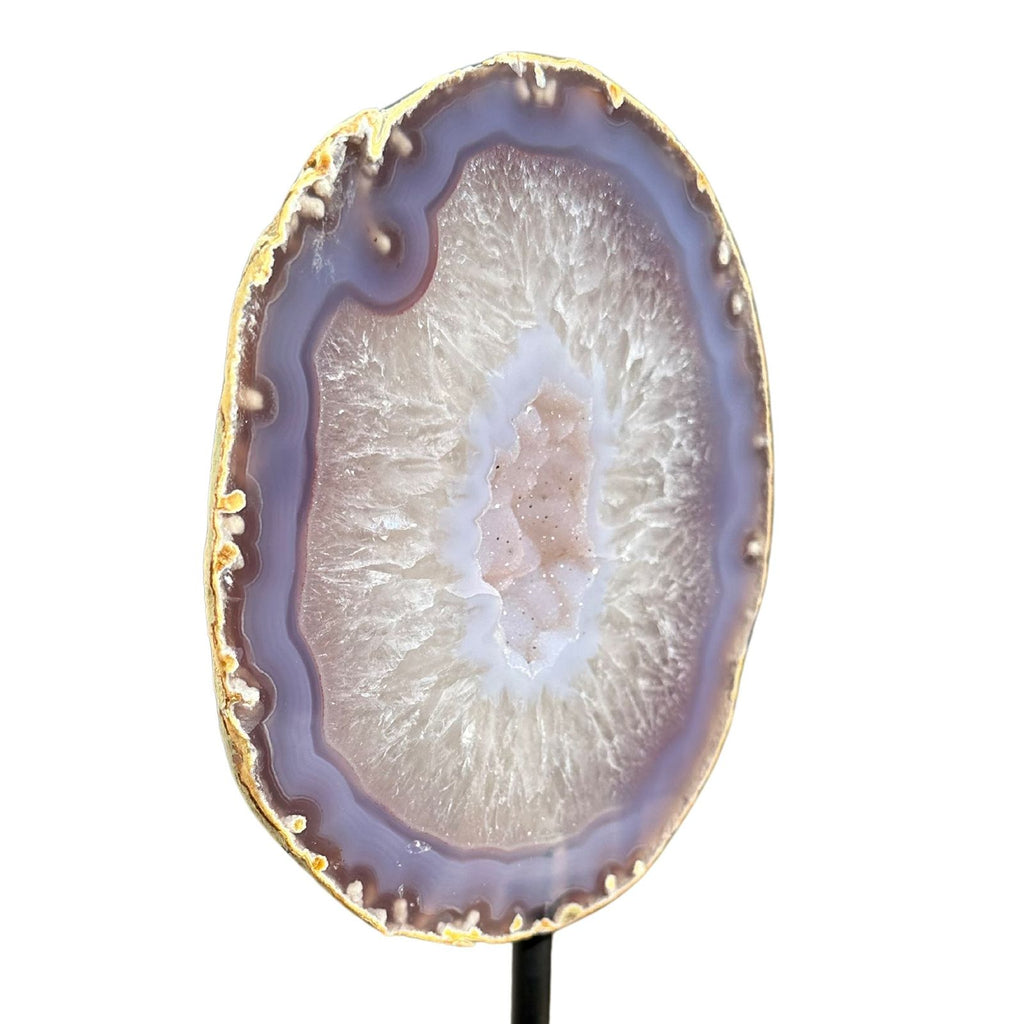 Side view of branded purple agate with clear quartz and druzy center