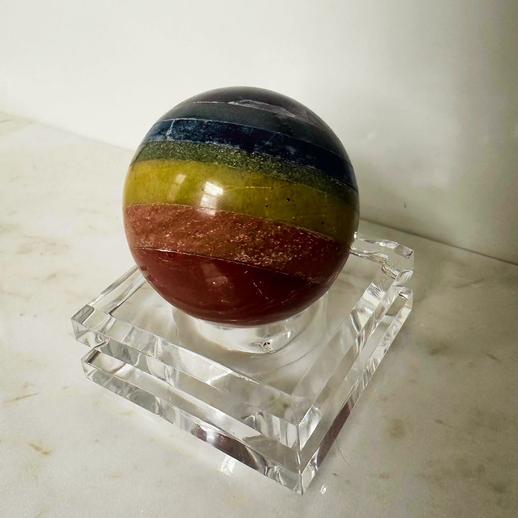 chakra crystal sphere on a base