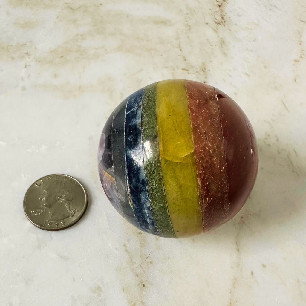 chakra sphere for balancing energy, next to quarter for reference
