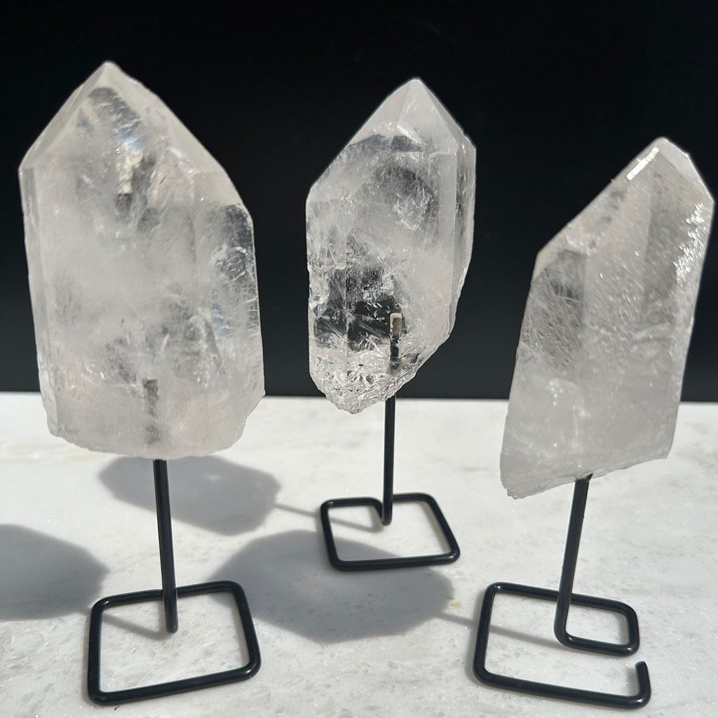 Clear Quartz Crystal Points on a stand