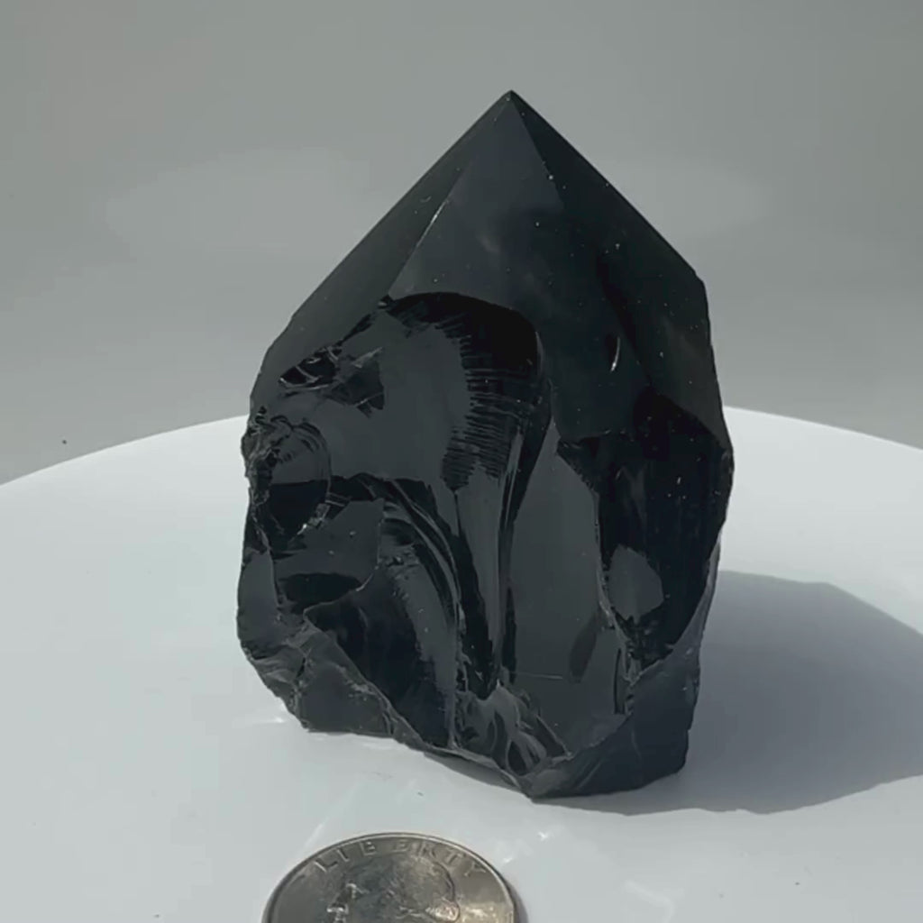Black Obsidian Volcanic Rock Glass rotating on display