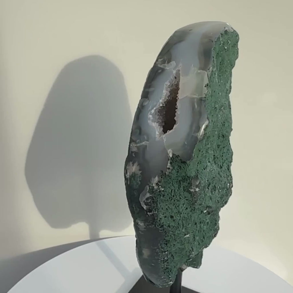 Brazilian crystal on a stand, slow rotating display for viewing. 