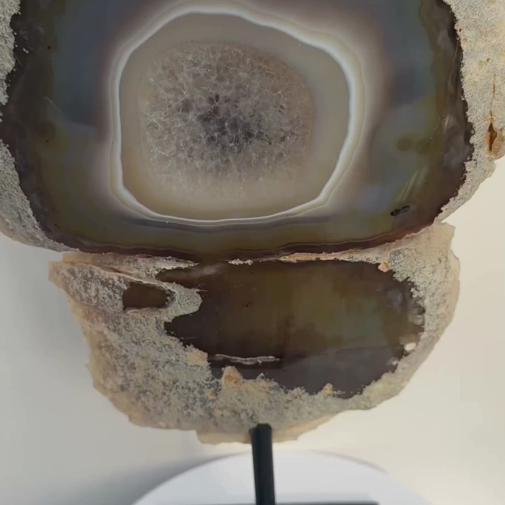 Natural Agate on a stand, with natural banded agate features, clear quartz inclusions and known for welcoming clarity and healing grief energetically