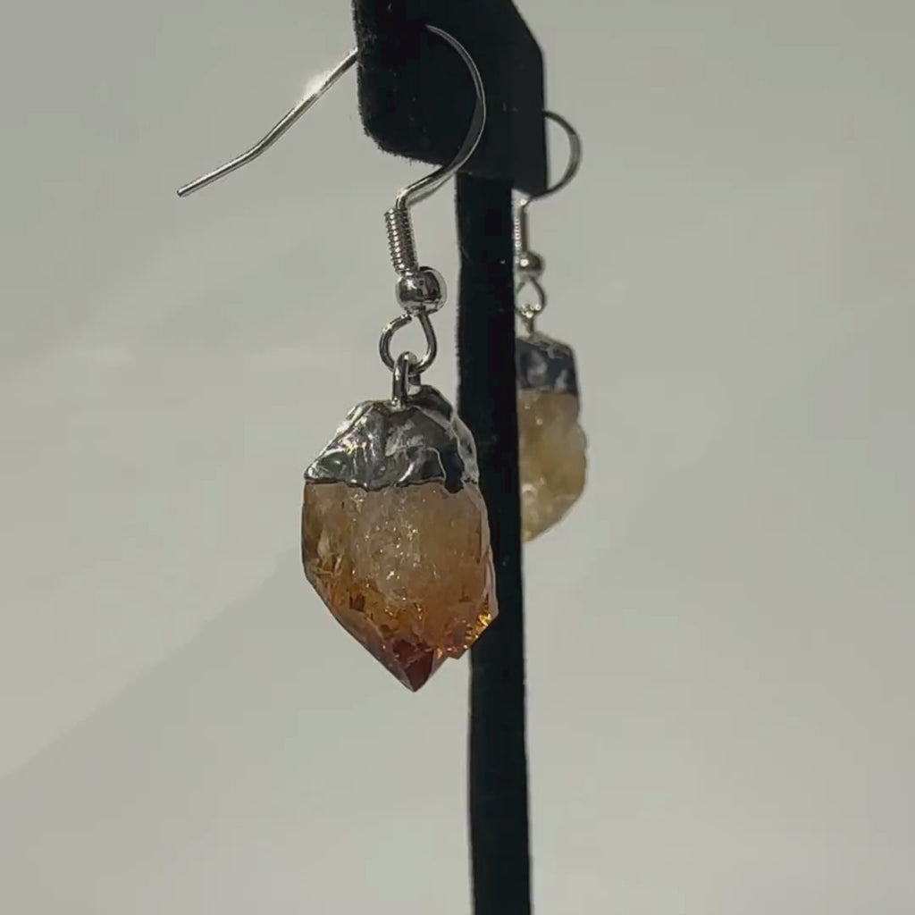 Raw Citrine Crystal Earrings on a rotating display for closer view
