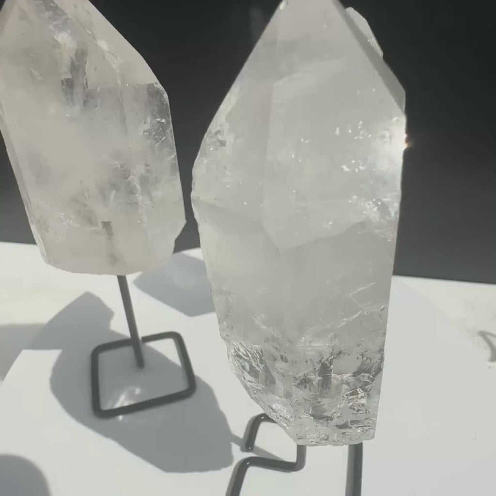 Clear Quartz Crystal Points on a stand, from Brazil, rotating for closer viewing. 