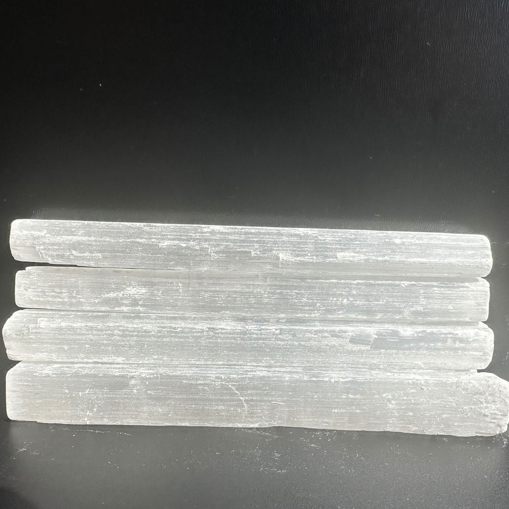 Raw Selenite Wands stacked in a group but sold individually