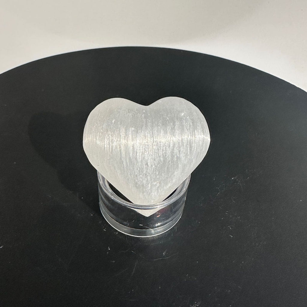 Selenite heart on a stand, polished crystal carving, known to clear energy of other crystals