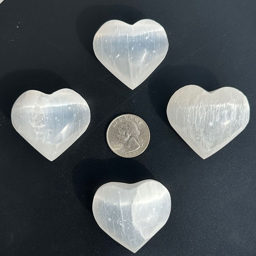 Selenite heart crystal carvings for crystals to clear and recharge their energy 